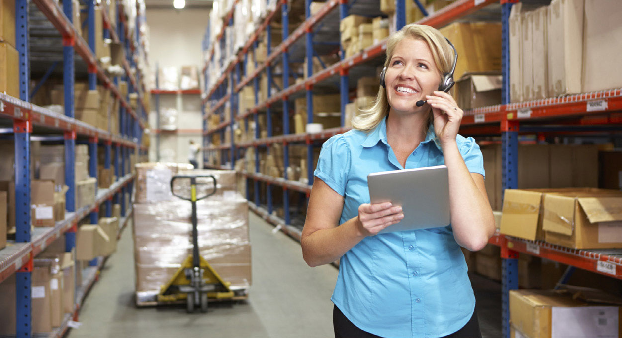 Smiling woman in warehouse